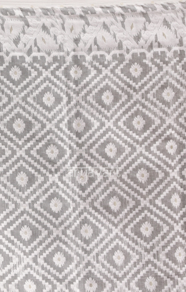 Sparkling White Saree with Geometric Woven Design With Zari Butta