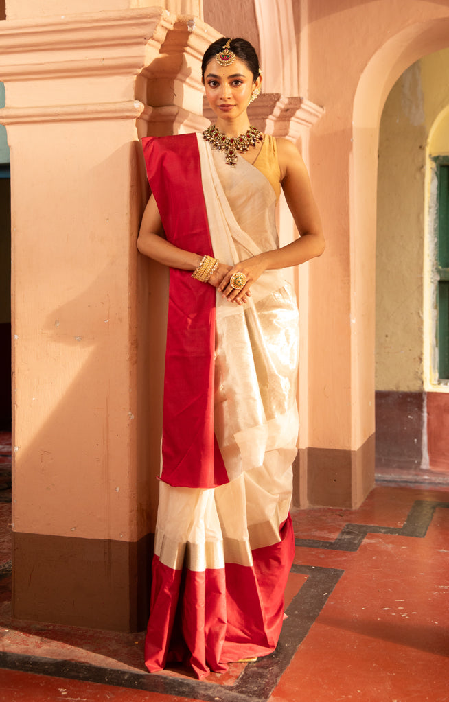 Pearl White Chanderi Saree with a striking Red Border
