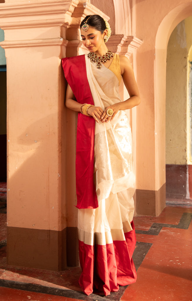 Pearl White Chanderi Saree with a striking Red Border