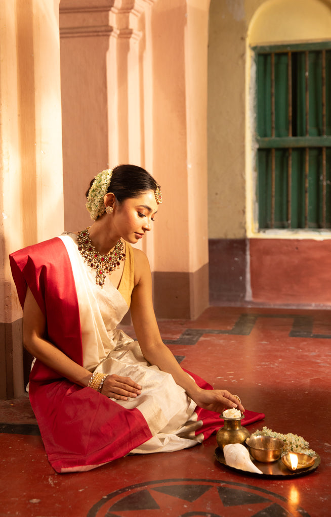 Pearl White Chanderi Saree with a striking Red Border