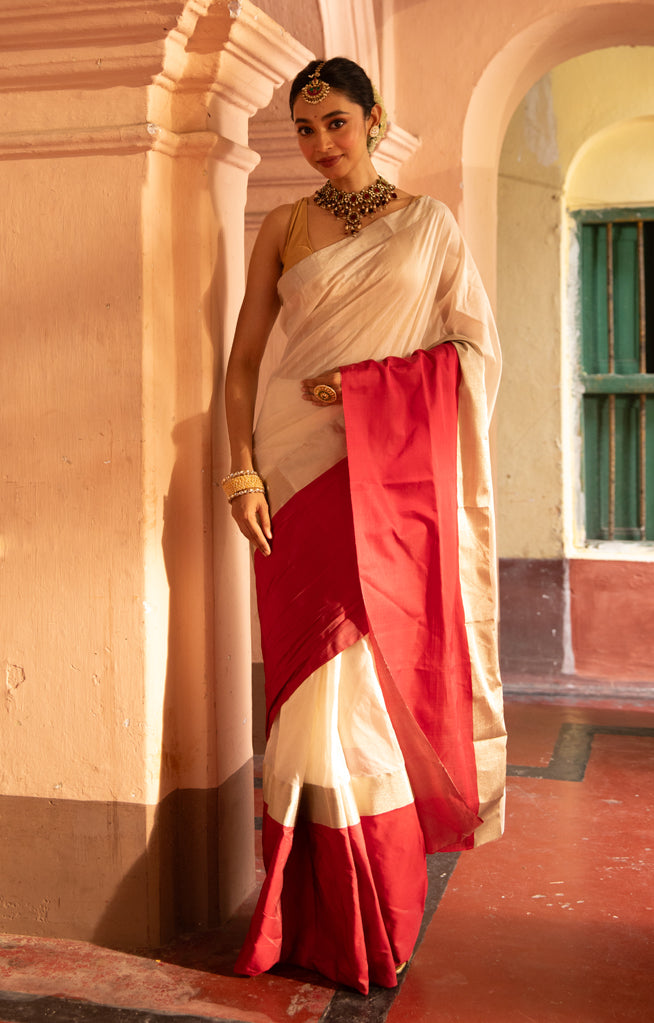 Pearl White Chanderi Saree with a striking Red Border