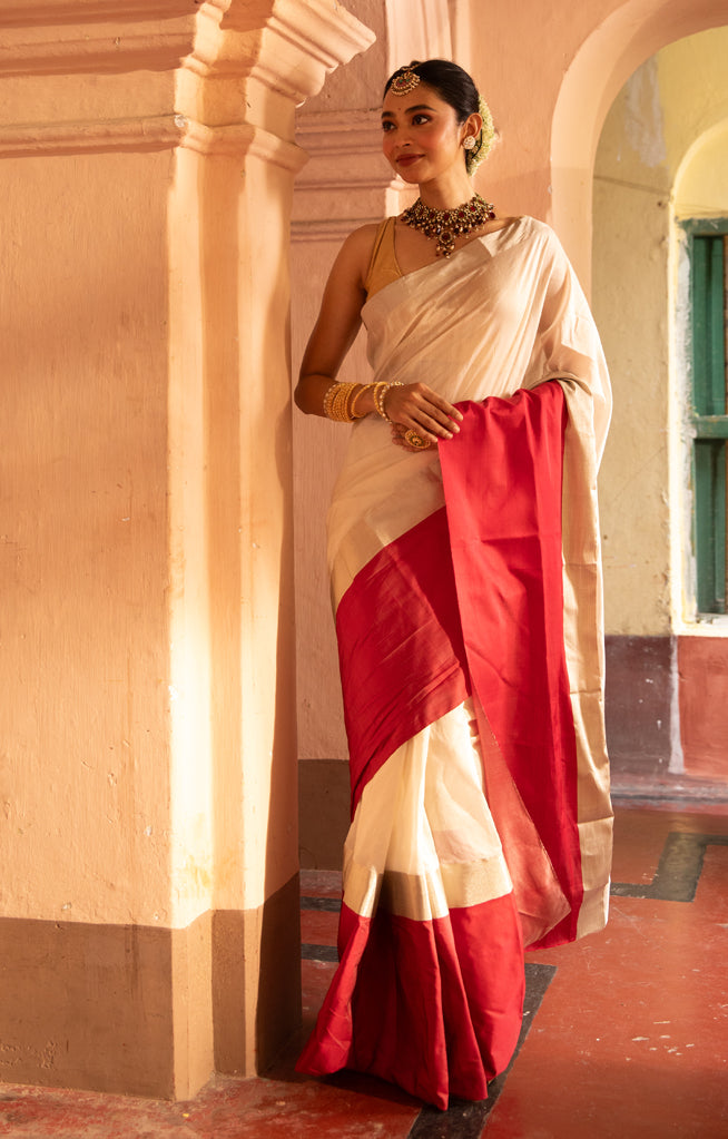 Pearl White Chanderi Saree with a striking Red Border
