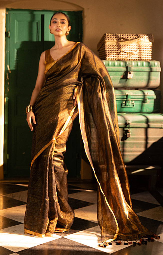 Versatile Black color and Tissue Linen Saree With a Thin and Zari Stripes
