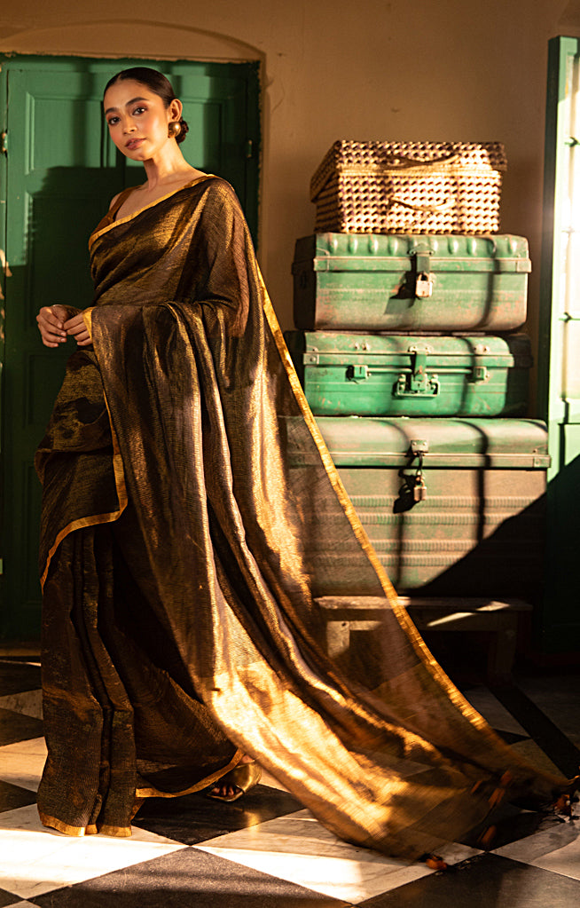 Versatile Black color and Tissue Linen Saree With a Thin and Zari Stripes