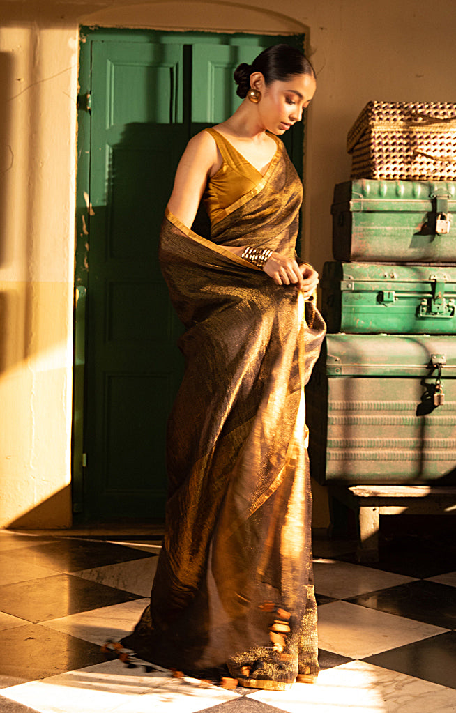 Versatile Black color and Tissue Linen Saree With a Thin and Zari Stripes
