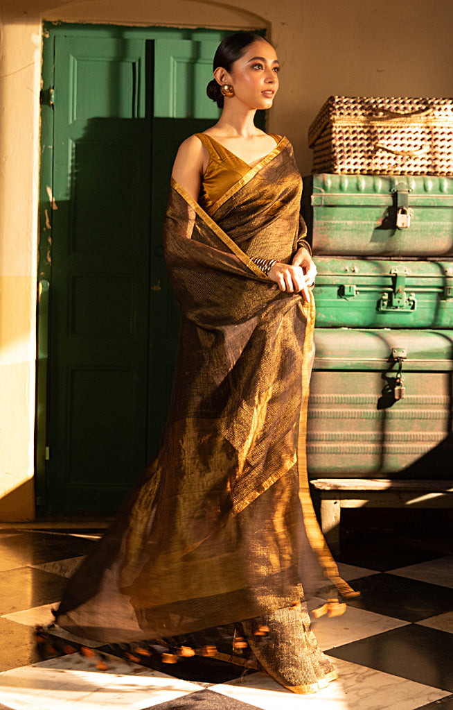 Versatile Black color and Tissue Linen Saree With a Thin and Zari Stripes