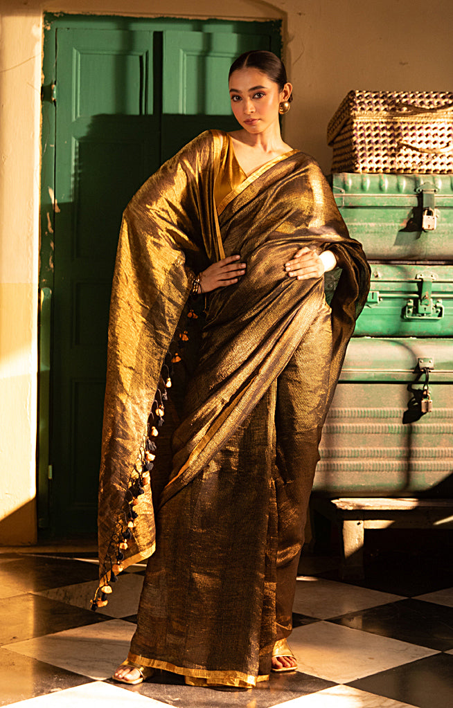 Versatile Black color and Tissue Linen Saree With a Thin and Zari Stripes