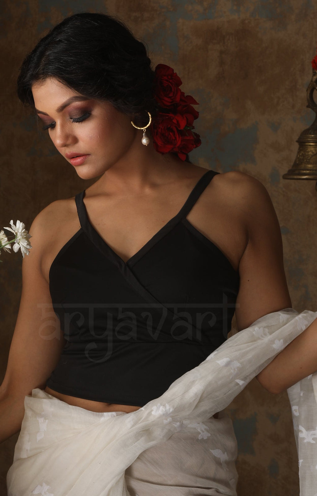 Black color  Lycra with  Strappy style type  Blouse