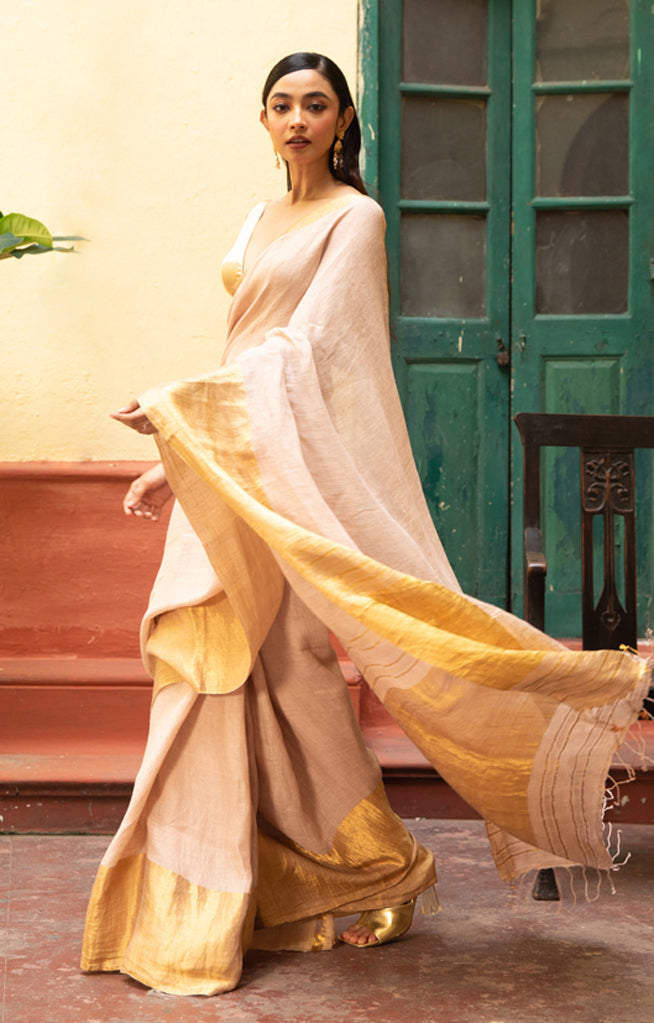 Coral Blossom Linen Saree With A Striking Gold Zari Border & Pallu