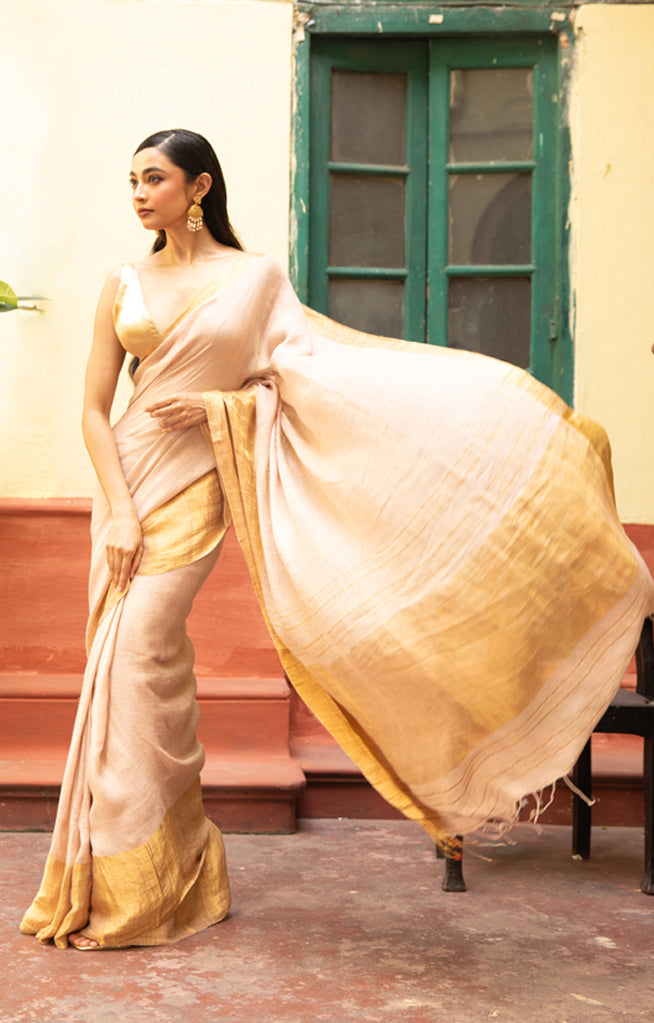Coral Blossom Linen Saree With A Striking Gold Zari Border & Pallu