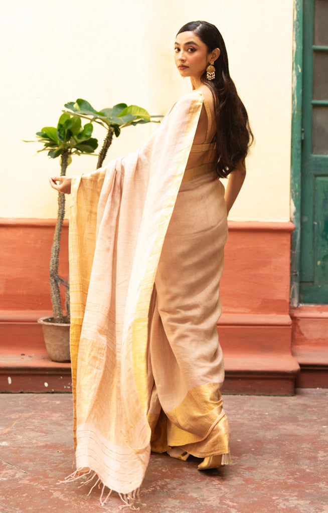 Coral Blossom Linen Saree With A Striking Gold Zari Border & Pallu
