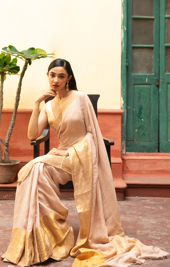 Coral Blossom Linen Saree With A Striking Gold Zari Border & Pallu