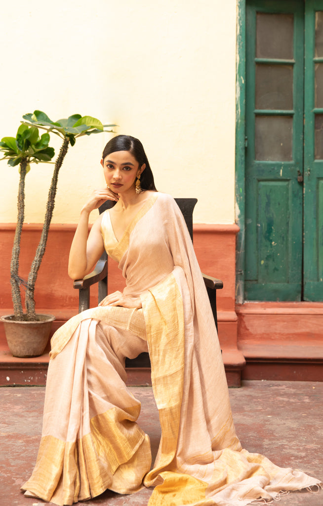 Coral Blossom Linen Saree With A Striking Gold Zari Border & Pallu